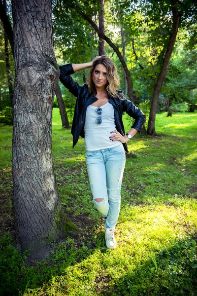 Fashion girl posing with leather jacket — Stock Photo, Image