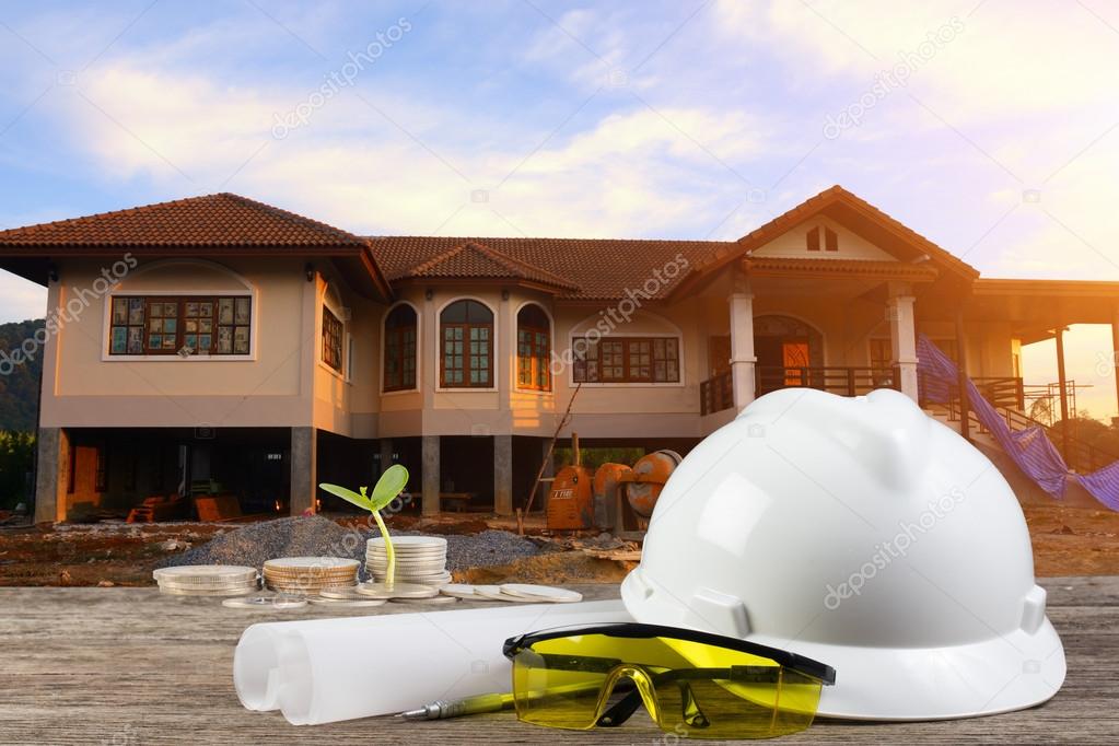 Business Growing  file of safety helmet and architect plant