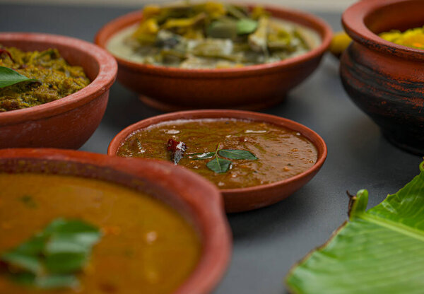 Kerala traditional feast side dishes arranged  in a two colour background,selective focus.