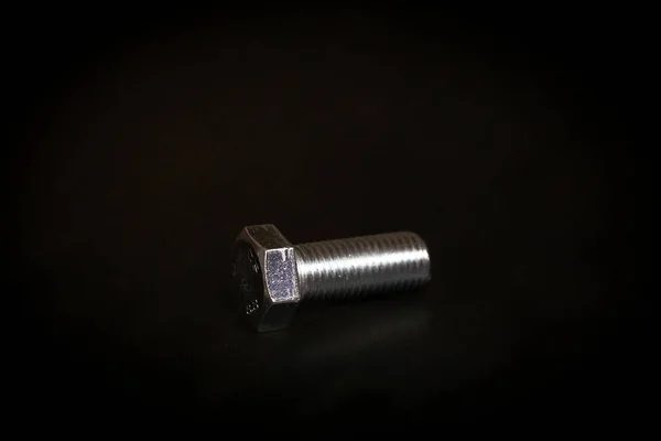 Glossy Hex Bolt Black Background — Stock fotografie