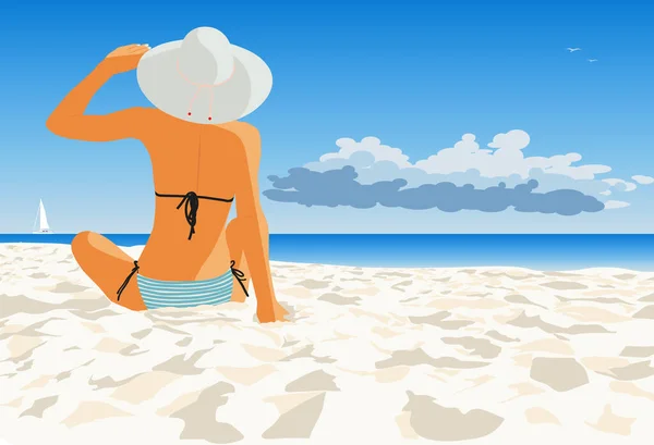 Sahilde bir kadın denize bakıyor.