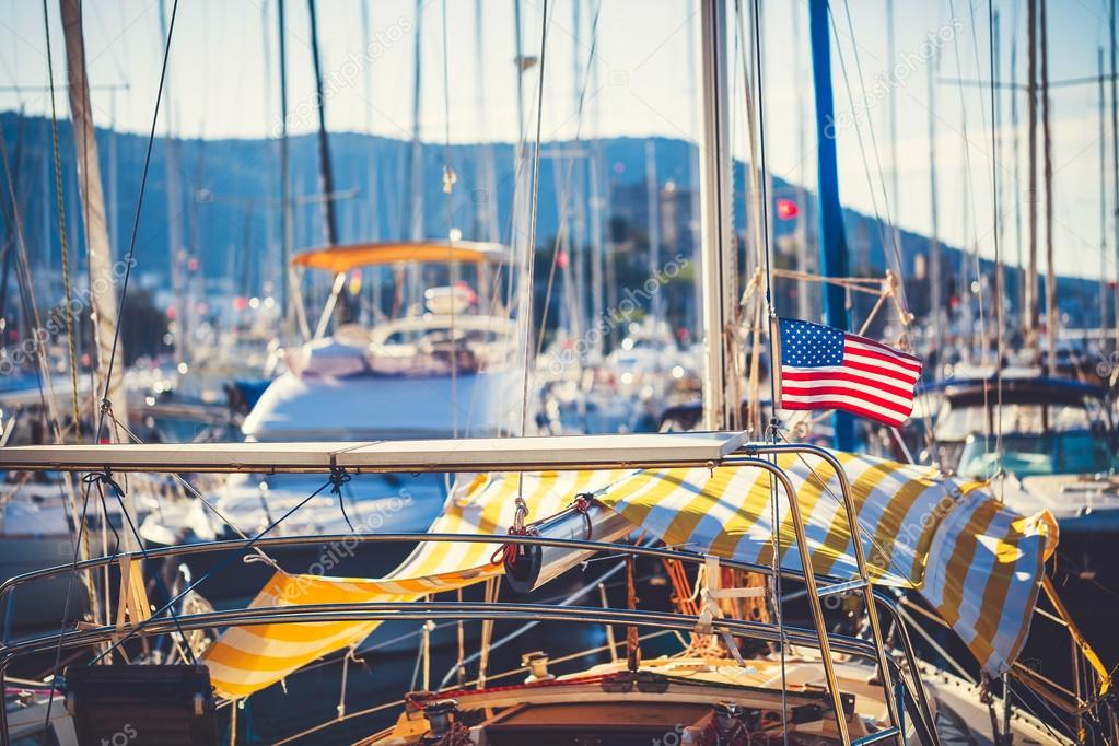 American flag waving from a sailboat 