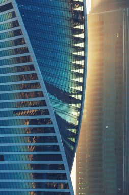 Sunlight on skyscraper. Glass Tower, high-tech, light rays