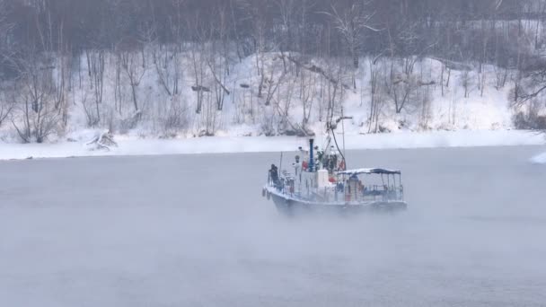 Industrial boat in the winter, sailing in the fog — Stock Video