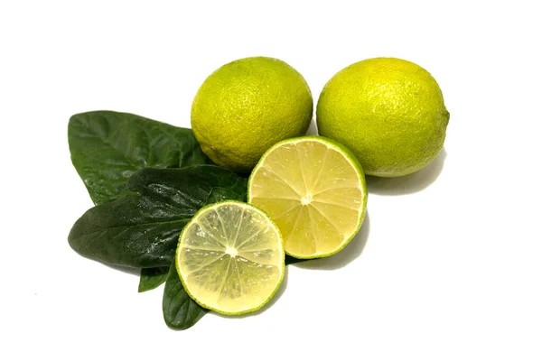 Fresh lime fruit. Whole fruits and cut. Lime leaves. Studio white background. — Stock Photo, Image