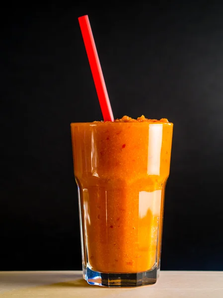 Carrot smoothie with black background — Stock Photo, Image