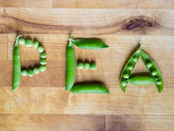 Palabra PEA escrita con guisantes — Foto de Stock