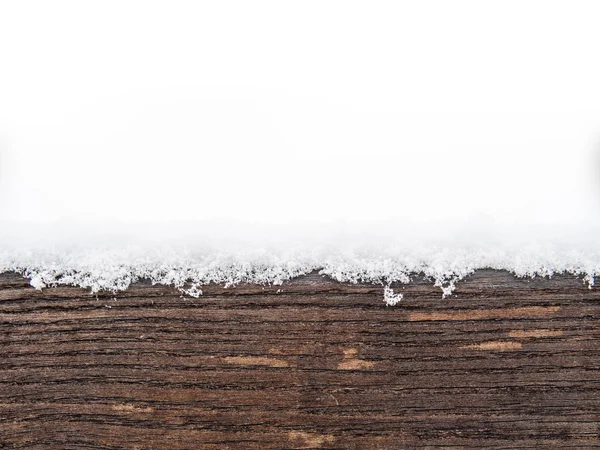 Painted wooden board or timber covered with snow — Stock Photo, Image