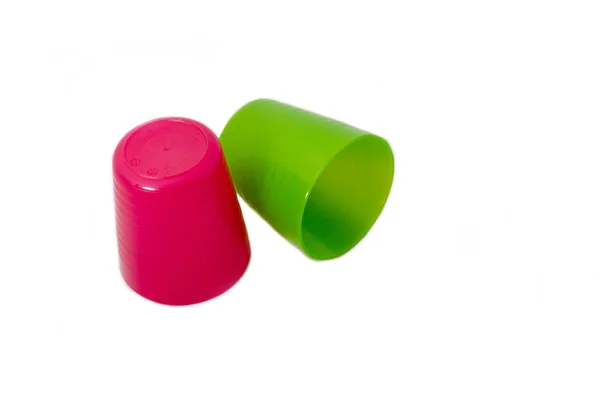 Пластиковые чашки красный и зеленый — стоковое фото
