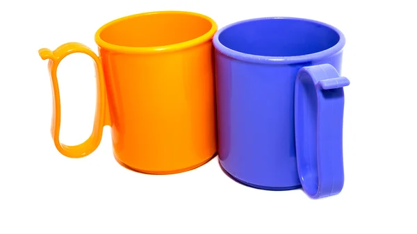 Kubki plastikowe pomarańczowy i niebieski — Zdjęcie stockowe
