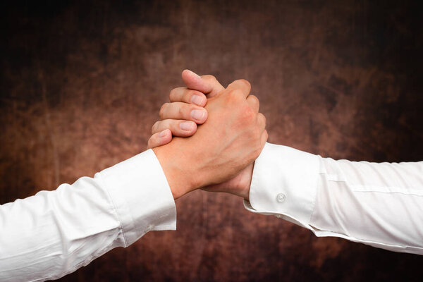 Corporate Businessmen Handshake Indoors.Two People Professionally Well Dressed Gesturing Togetherness.Working Colleague Partners Sign Deal In Agreement To Contract