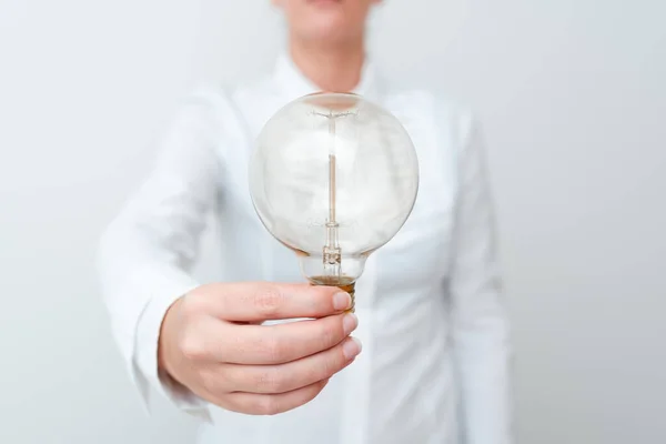 Lady Holding Lamp With Formal Outfit Presenting New Ideas For Project, Business Woman Showing Bulb With One Hand Exhibiting New Technologies, Lightbulb Presenting Another Openion