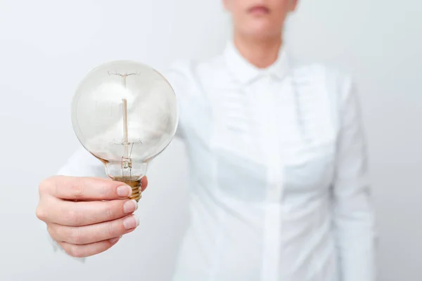 Lady Holding Lamp With Formal Outfit Presenting New Ideas For Project, Business Woman Showing Bulb With One Hand Exhibiting New Technologies, Lightbulb Presenting Another Openion