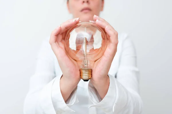 Lady Holding Lamp With Formal Outfit Presenting New Ideas For Project, Business Woman Showing Bulb With Two Hands Exhibiting New Technologies, Lightbulb Presenting Another Openion