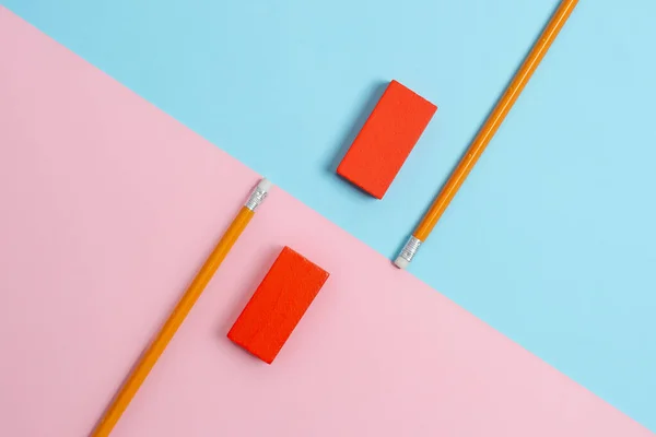 Comparison of Two Objects Blocks Pencils Sticker Notes Facing Inward Outward Making An Arrangement Reflection On a Separated Coloured Background Shot In A Flat Lay Perspective