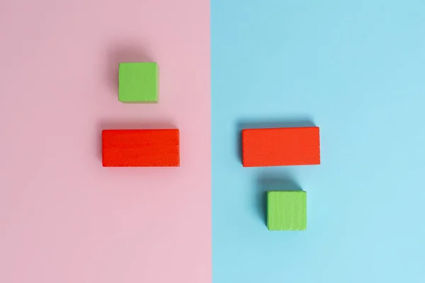 Comparison of Two Objects Blocks Pencils Sticker Notes Facing Inward Outward Making An Arrangement Reflection On a Separated Coloured Background Shot In A Flat Lay Perspective