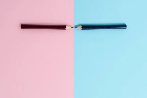 Comparison of Two Objects Blocks Pencils Sticker Notes Facing Inward Outward Making An Arrangement Reflection On a Separated Coloured Background Shot In A Flat Lay Perspective