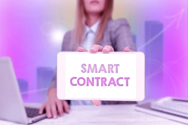Hand writing sign Smart Contract. Business concept digital agreement to control the transfer of digital currencies Business Woman Sitting In Office Holding Mobile Displaying Futuristic Ideas.