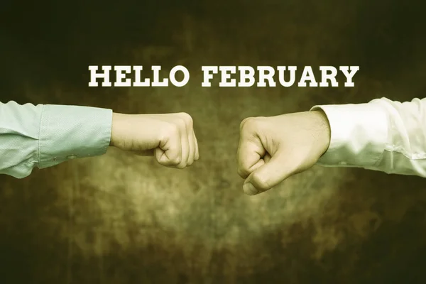 Sign displaying Hello February. Conceptual photo greeting used when welcoming the second month of the year Two Professional Well-Dressed Corporate Businessmen Handshake Indoors —  Fotos de Stock