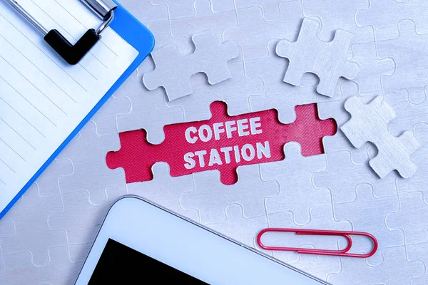 Conceptual caption Coffee Station. Word for a small, informal restaurant that typically serves hot drinks Building An Unfinished White Jigsaw Pattern Puzzle With Missing Last Piece — Stockfoto