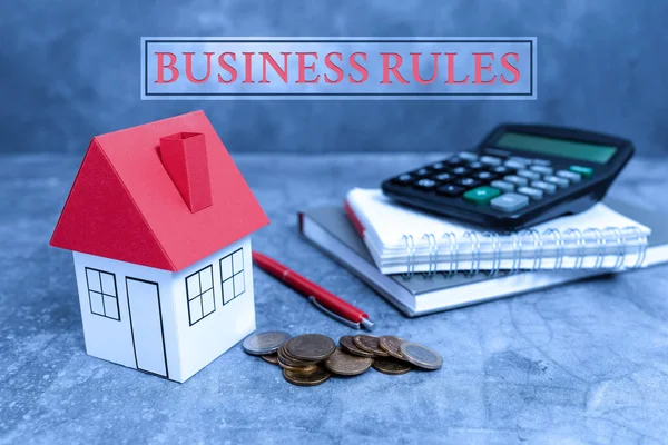 Writing displaying text Business Rules. Concept meaning the principles which determine the corporation s is activities Creating Property Contract To Sell, Presenting House Sale Deal —  Fotos de Stock