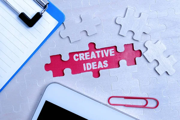 Handwriting text Creative Ideas. Concept meaning Unique strategy for captivating audiences interest Building An Unfinished White Jigsaw Pattern Puzzle With Missing Last Piece — Stockfoto