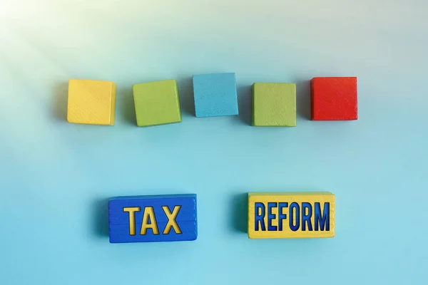 Titulek textu představující daňovou reformu. Word for government policy about the collection of taxes with business owners Stack of Sample Cube Rectangular Boxes On Surface Leštěné S Multi-Colour — Stock fotografie