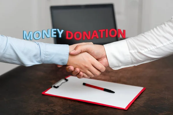 Text showing inspiration Money Donation. Word for a charity aid in a form of cash offered to an association Two Professional Well-Dressed Corporate Businessmen Handshake Indoors — Stock Photo, Image