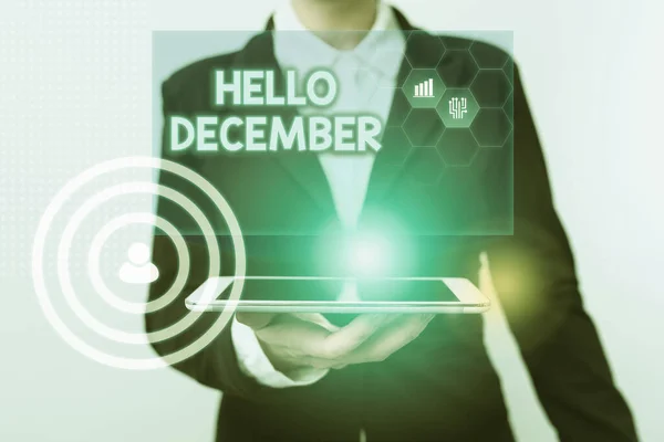 Text showing inspiration Hello December. Word Written on greeting used when welcoming the twelfth month of the year Woman In Suit Standing Using Device Showing New Futuristic Virtual Tech.