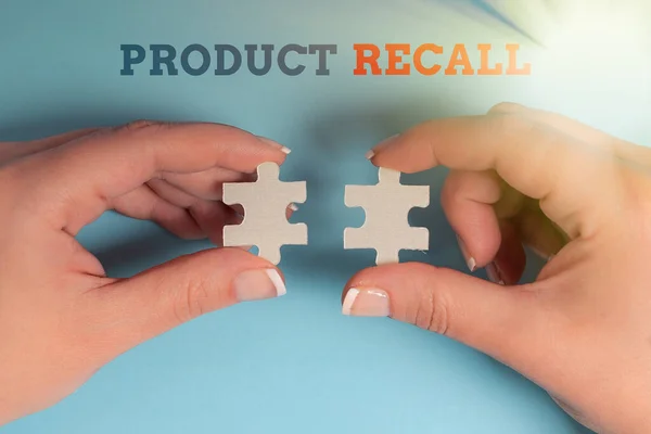 Text sign showing Product Recall. Business showcase request to return the possible product issues to the market Building An Unfinished White Jigsaw Pattern Puzzle With Missing Last Piece