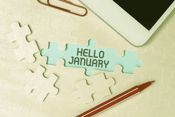 Exibição conceitual Hello January. Visão geral de negócios saudação usada ao receber o primeiro mês do ano Construindo um quebra-cabeça de padrão branco inacabado com falta última peça — Fotografia de Stock