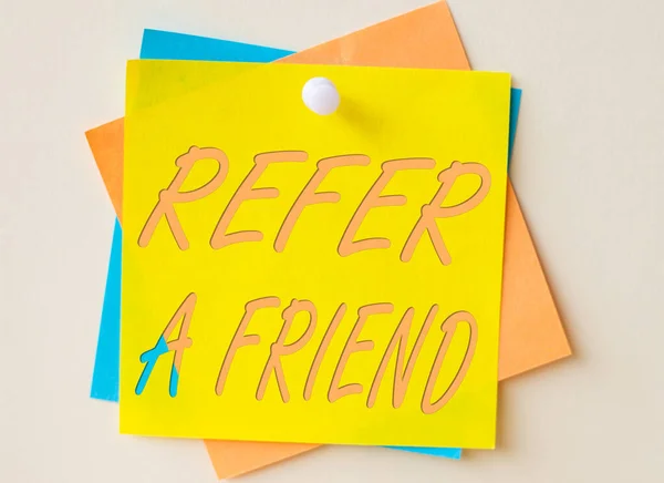 Hand writing sign Refer A Friend. Word Written on direct someone to another or send him something like gift Colorful Paper Notes Stacked Together And Pinned On The Wall. — Stock Photo, Image