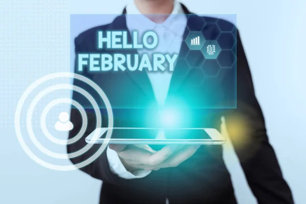 Kézírás üzenet Hello February. Word for greeting az év második hónapjának köszöntésekor Woman in Suit Standing Using Device Show New Futuristic Virtual Tech. — Stock Fotó