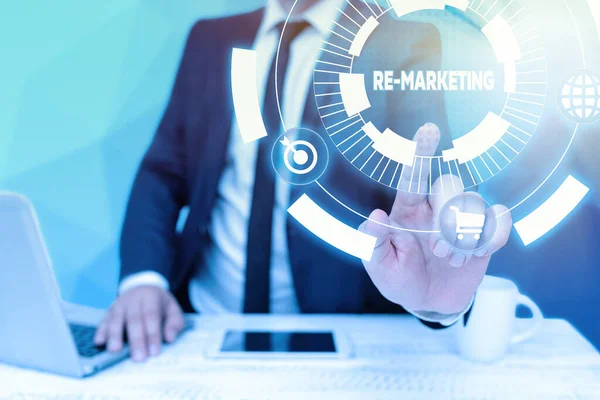 Writing displaying text Re Marketing. Business overview Strategy to reach potential customers in your website Bussiness Man Sitting Desk Laptop And Phone Pointing Futuristic Technology. — Stock Photo, Image