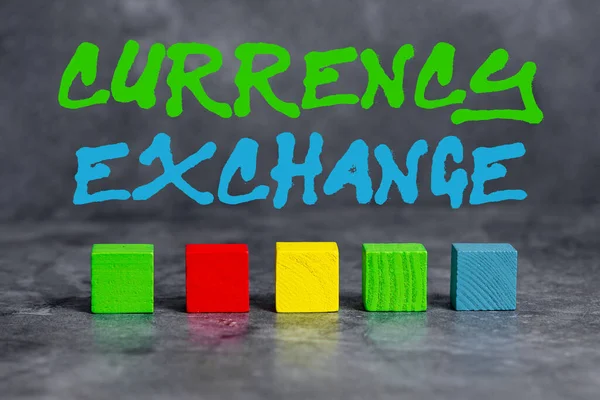 Hand writing sign Currency Exchange. Concept meaning rate at which one currency will be exchanged for another Stack of Sample Cube Rectangular Boxes On Surface Polished With Multi-Colour — Stock Fotó