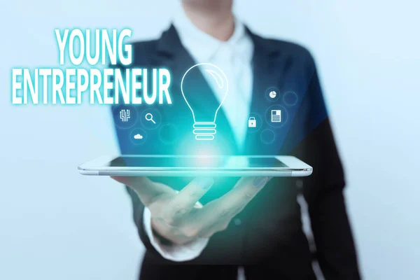 Writing displaying text Young Entrepreneur. Business overview someone that started their own business at young age Lady In Suit Presenting Mobile Device With Futuristic Interface Tech. — Stock Photo, Image