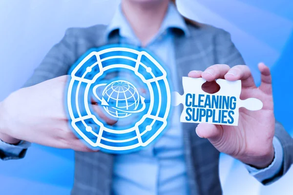 Conceptual caption Cleaning Supplies. Business concept substances usually liquids used to remove dirt and dust Business Woman Pointing Jigsaw Puzzle Piece Unlocking New Futuristic Tech. — Stockfoto