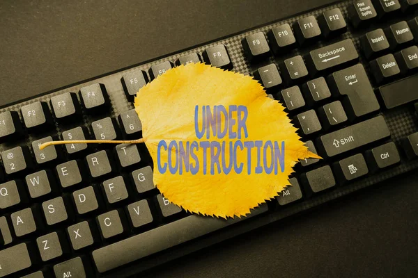 Conceptual display Under Construction. Business concept project that is unfinished but actively being worked on Online Browsing And Exploring, Creating Blog Content, Sending New Messages — Stock Photo, Image