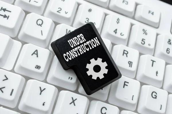 Conceptual caption Under Construction. Business approach project that is unfinished but actively being worked on Creating A New Book, Playing Computer Games, Copywriting New Content — Stock Photo, Image