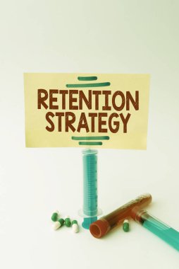 Conceptual caption Retention Strategy. Business idea activities to reduce employee turnover and attrition Writing Important Medical Notes Laboratory Testing Of New Infections