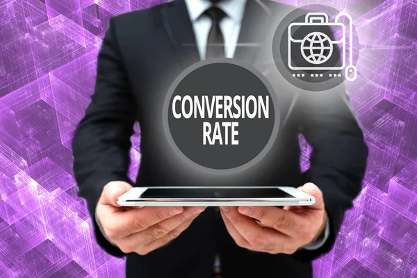 Inspiration showing sign Conversion Rate. Word for number of visitors to a website that meet the desired goal Man In Office Uniform Holding Tablet Displaying New Modern Technology. —  Fotos de Stock