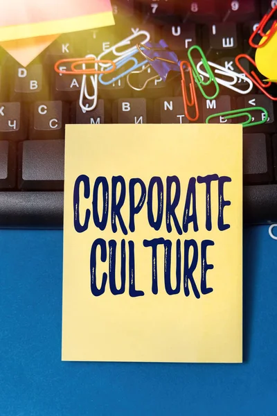 Text showing inspiration Corporate Culture. Business overview beliefs and attitudes that characterize a company Multiple Assorted Collection Office Stationery Photo Placed Over Table