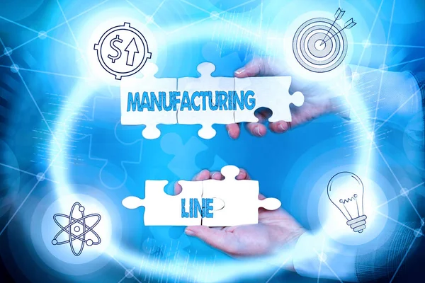 Conceptual caption Manufacturing Line. Word Written on set of sequential operations established in a factory Hand Holding Jigsaw Puzzle Piece Unlocking New Futuristic Technologies.