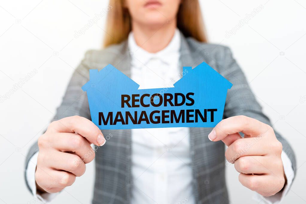 Hand writing sign Records Management. Conceptual photo administration of records and documented information A Young Lady Businesswoman Holding Presenting Home In Business Outfit