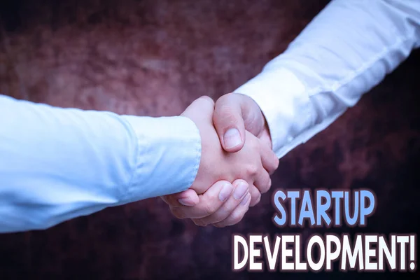 Text showing inspiration Startup Development. Word for efficiently develop and validate scalable business model Two Professional Well-Dressed Corporate Businessmen Handshake Indoors — Stock Photo, Image