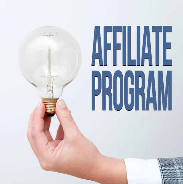 Conceptual caption Affiliate Program. Business showcase automated electronic program that involve a web advertiser Hand holding lamp showing or presenting new technology ideas — 스톡 사진