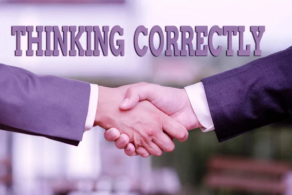 Writing displaying text Thinking Correctly. Concept meaning principle that you think are sensible and morally correct Two Professional Well-Dressed Corporate Businessmen Handshake Indoors — Stok fotoğraf