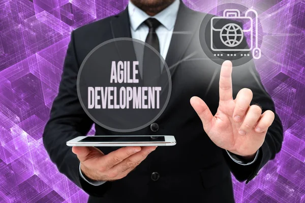 Text caption presenting Agile Development. Word Written on alliance between selforganizing crossfunctional team Man In Office Uniform Standing Pressing Virtual Button Holding Tablet. — Stok fotoğraf