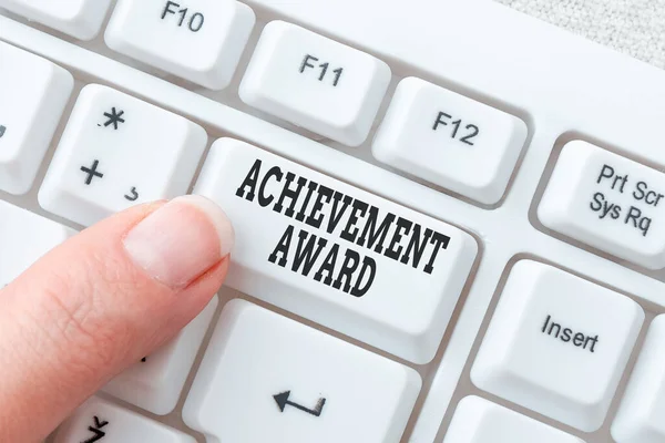 Hand writing sign Achievement Award. Internet Concept recognizes worthy and outstanding achievement in job skill Lady finger showing-pressing keyboard keys-buttons for update — Stok fotoğraf