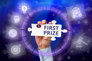 Text showing inspiration First Prize. Word Written on most coveted prize that is only offered to the overall winner Hand Holding Jigsaw Puzzle Piece Unlocking New Futuristic Technologies.